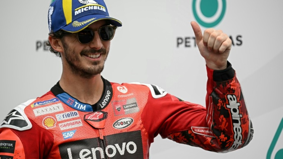 Italian MotoGP rider Francesco Bagnaia celebrates coming first in qualifying