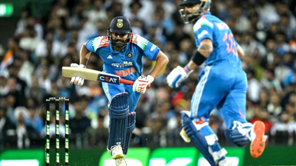 India's Rohit Sharma (L) and Virat Kohli run between the wicket during the third one-day international against Australia