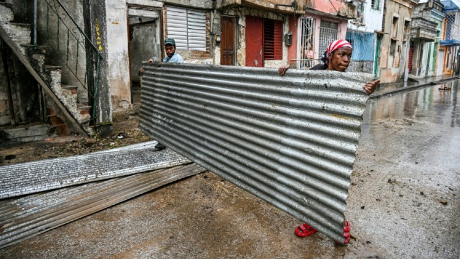 Residents prepare for the arrival of Hurricane Melissa in the Cuban city of Santiago de Cuba, on October 28, 2025