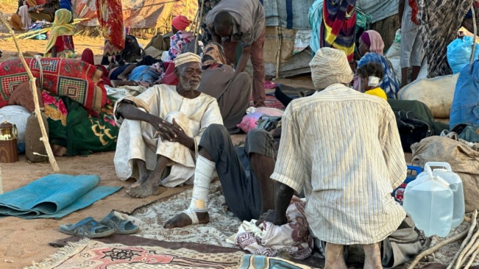 Displaced Sudanese who fled El-Fasher after the city fell to the Rapid Support Forces (RSF), rest near the town of Tawila in war-torn Sudan's western Darfur region