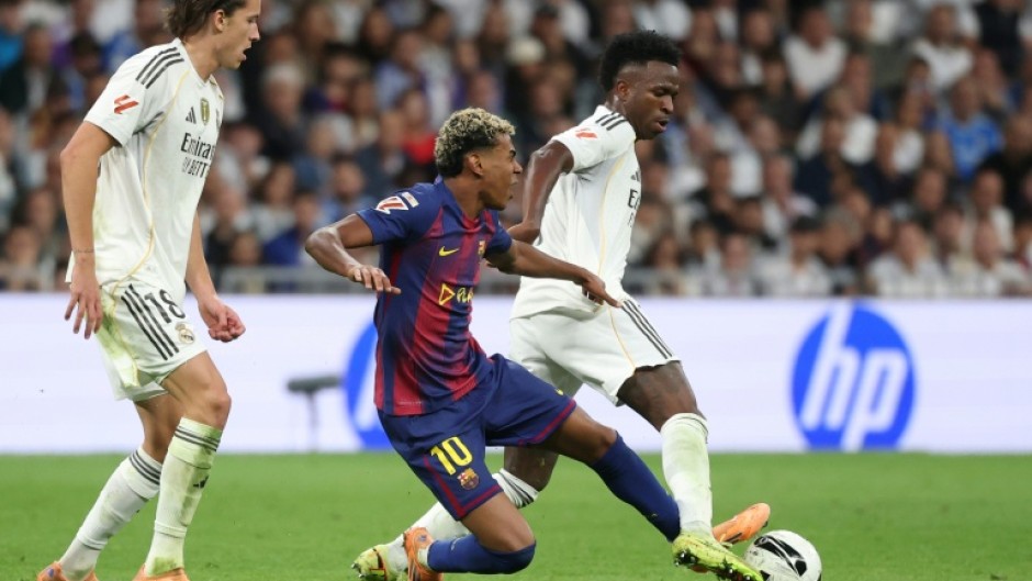 Vinicius Junior and Lamine Yamal fight for the ball during last weekend's Clasico, in which Real Madrid beat Barcelona 2-1