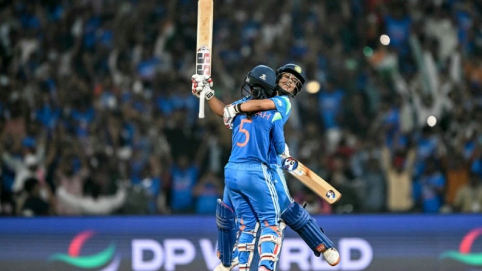 Jemimah Rodrigues (front) and Amanjot Kaur celebrate their epic run chase to make the Women's World Cup final