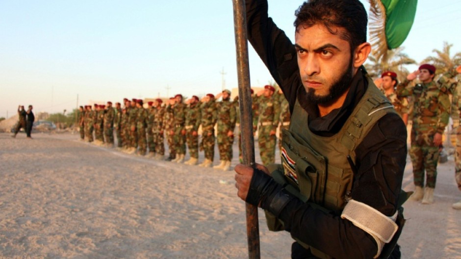 A member of the Iraqi Shiite Muslim Mehdi Army, which also fought in Syria's civil war