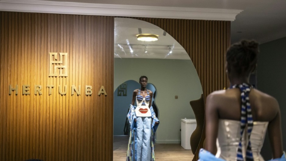 A model tries on an outfit from Nigerian brand Hertunba during a fitting session in Lagos