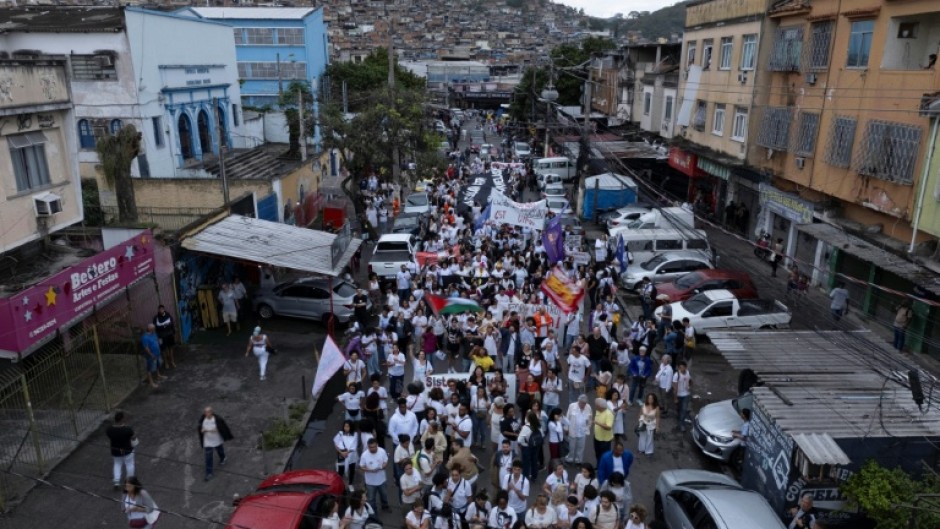 Favela residents have taken to the streets to protest a police operation that killed over 120 people