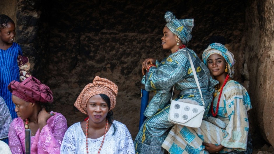 The brides were feted by dancers and musicians