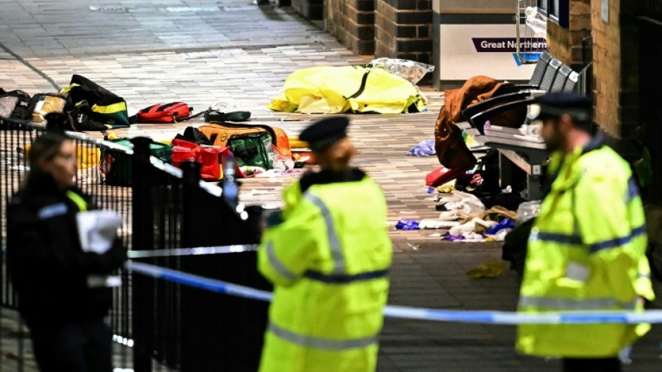 Paramedics medical equipment is pictured inside a police cordon at Huntingdon Station in eastern England