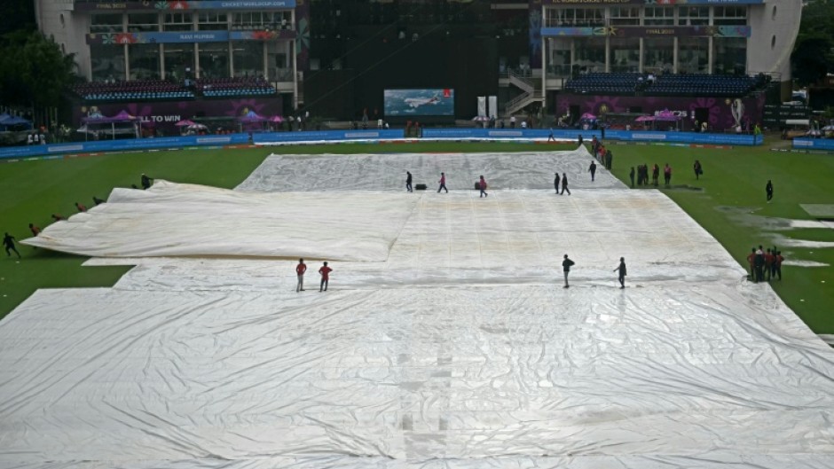 Raincovers on the pitch before the start of the Women's World Cup final