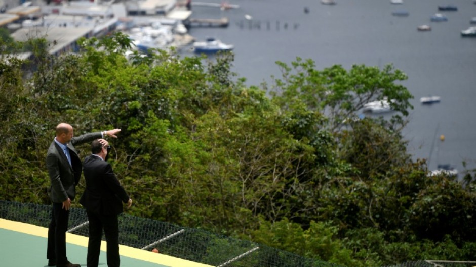 Britain's Prince William met with Rio de Janeiro's mayor Eduardo Paes a week after a horrific clash between police and gangs that killed 121 people