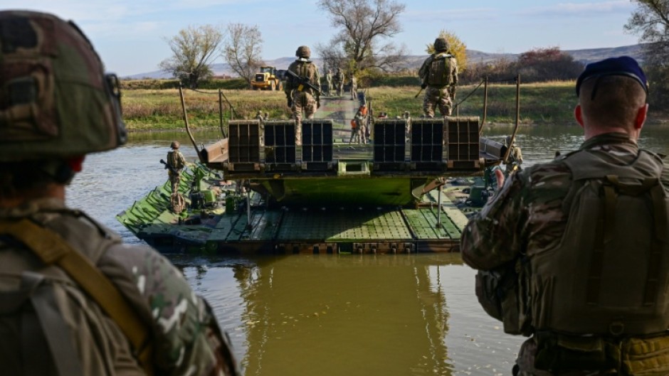 In the drill, a multinational brigade is conducting maneuvers and live-fire artillery and tank exercises, together with Romanian troops