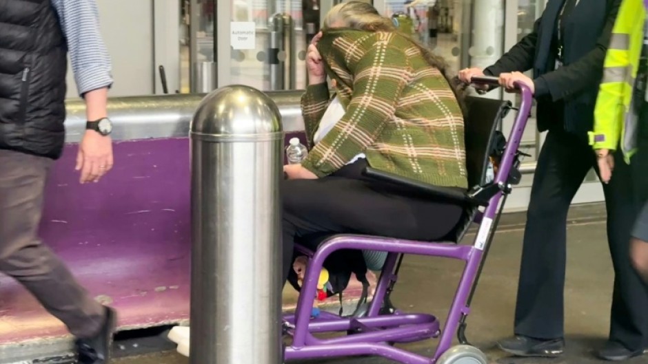 Lindsay Sandiford is wheeled out of Heathrow airport after landing at Terminal 4 as part of a repatriation agreement between Indonesia and the UK