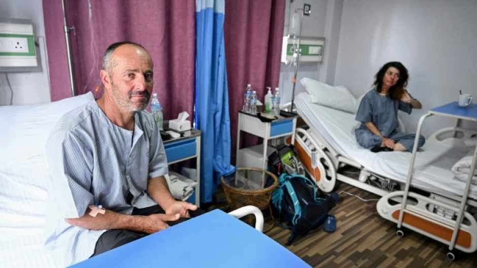 Avalanche survivors Didier Armand Berton (L) and Isabelle Thaon in a Kathmandu hospital