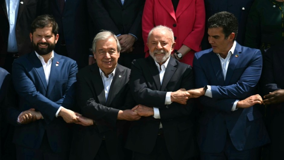 (L-R) Chile's President Gabril Boric, the Secretary-General of the United Nations, Antonio Guterres, Brazil's President Luiz Inacio Lula da Silva and the Governor of the state of Para, Helder Barbalho, attend a 'family photo'