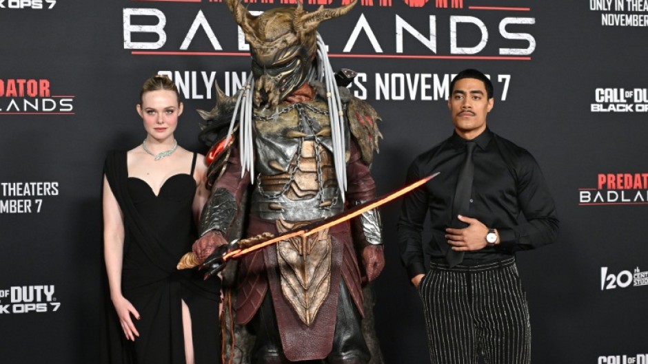 US actress Elle Fanning (L) and New Zealand actor Dimitrius Schuster-Koloamatangi star in 'Predator: Badlands'
