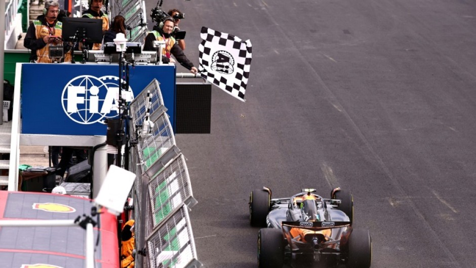 Lando Norris takes the chequered flag at Interlagos to move 24 points clear in the driver's title battle