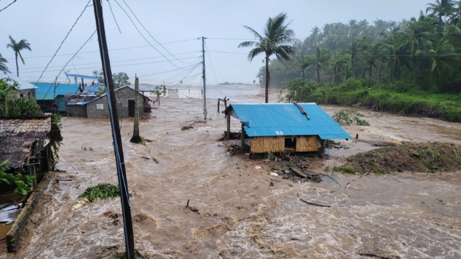 Houses in the Philippines Catanduanes province were swamped by surging floodwaters from Typhoon Fung-wong