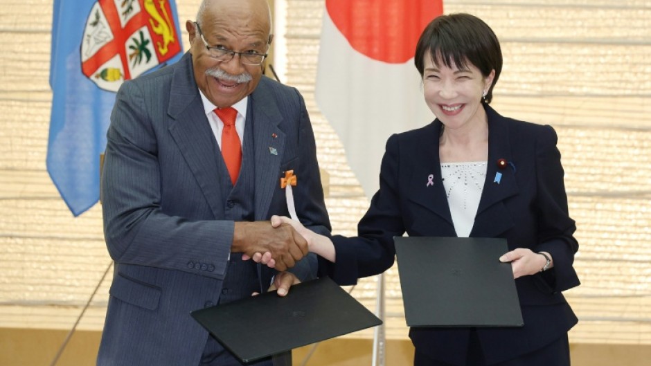 Sleep is for slackers: Japan's Prime Minister Sanae Takaichi (right)