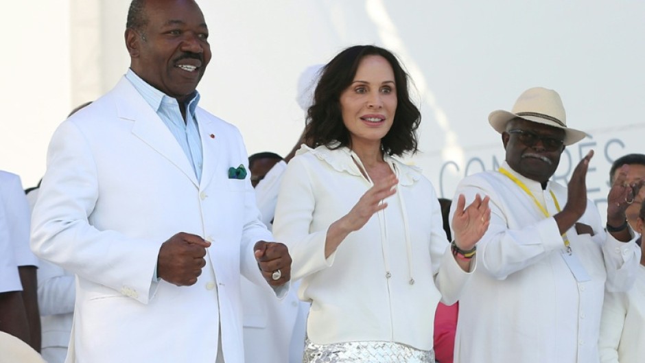Gabon's Sylvia Bongo (C) was accused of manipulating her husband Ali Bongo (L) to embezzle taxpayers' money