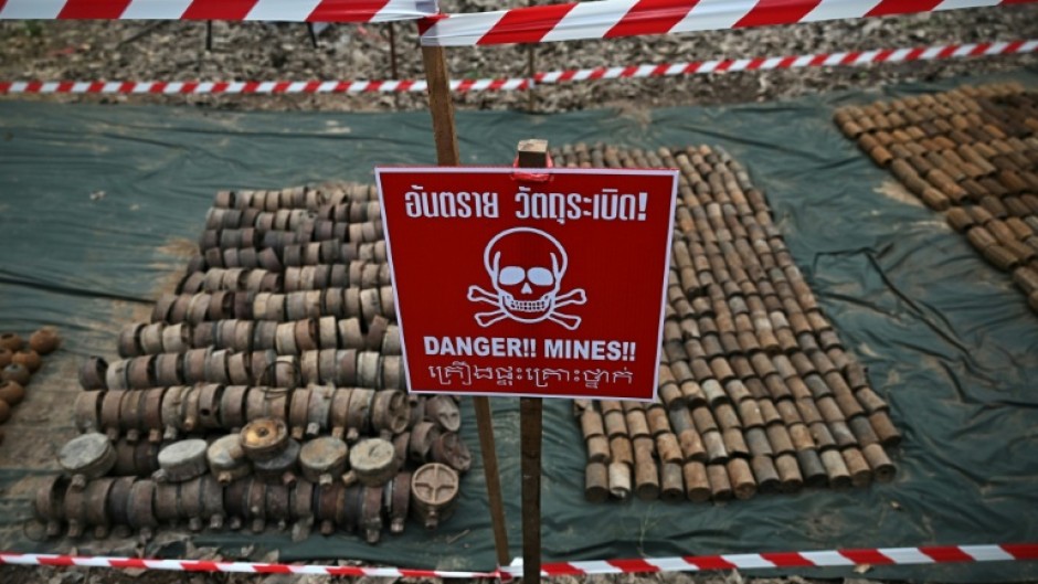 Thailand has suspended the implementation of a peace agreement with neighbouring Cambodia after a landmine blast injured two Thai soldiers near the border