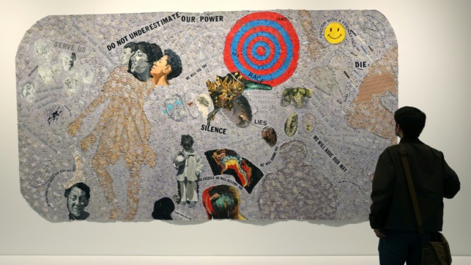 A person looks at a piece by US artist Howardena Pindell entitled 'Autobiography: Scapegoat' at the Studio Museum in Harlem in New York