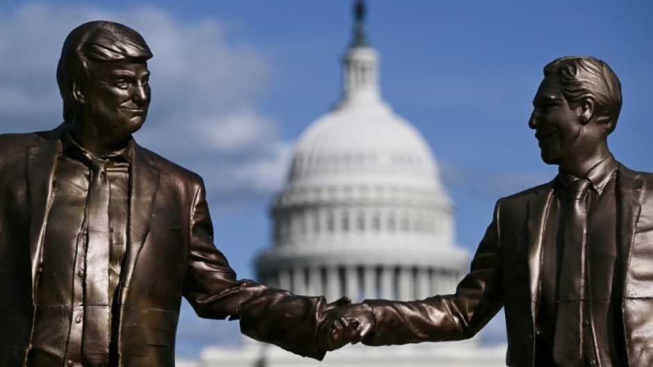 A statue depicting US President Donald Trump and Jeffrey Epstein holding hands is seen near the US Capitol on October 2, 2025