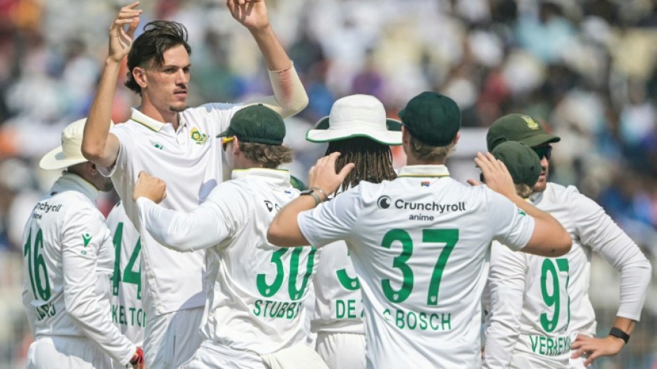 South Africa's Marco Jansen celebrates with teammates after taking the wicket of India's KL Rahul