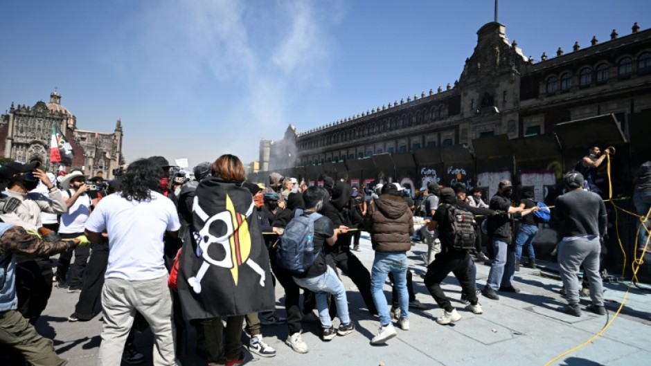 Many protesters carried the pirate flag emblematic of the Japanese manga 'One Piece,' which has become a symbol of global youth protest