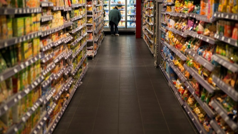 File: A customer looking at a fridge in a store. AFP/Joel Saget