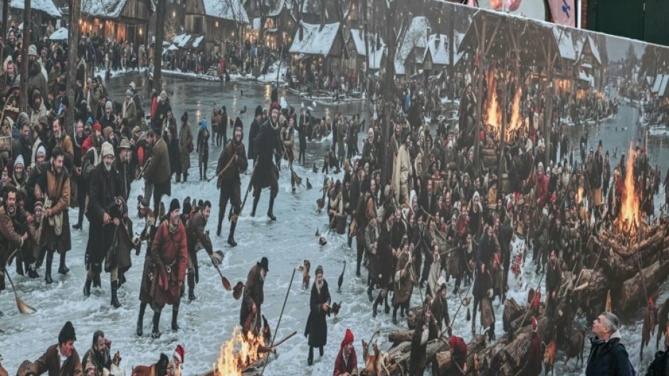 The display at first glance seems to depict a jolly crowd enjoying the festive season