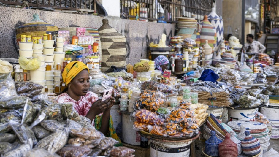 A vendor is seen at a Dakar market in January 2025 in Senegal, which is working to secure a new IMF aid program