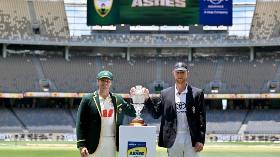 Australia captain Steve Smith (L) and England skipper Ben Stokes with the Ashes trophy
