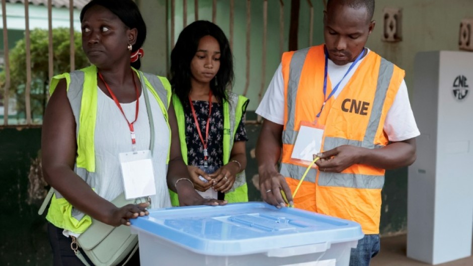 National Electoral Commission officials handled ballot boxes