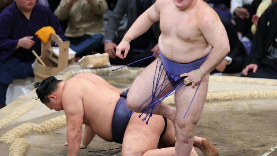 Danylo Yavhusishyn (R), known by his Japanese ring name Aonishiki Arata, is the first Ukrainian to win a sumo tournament