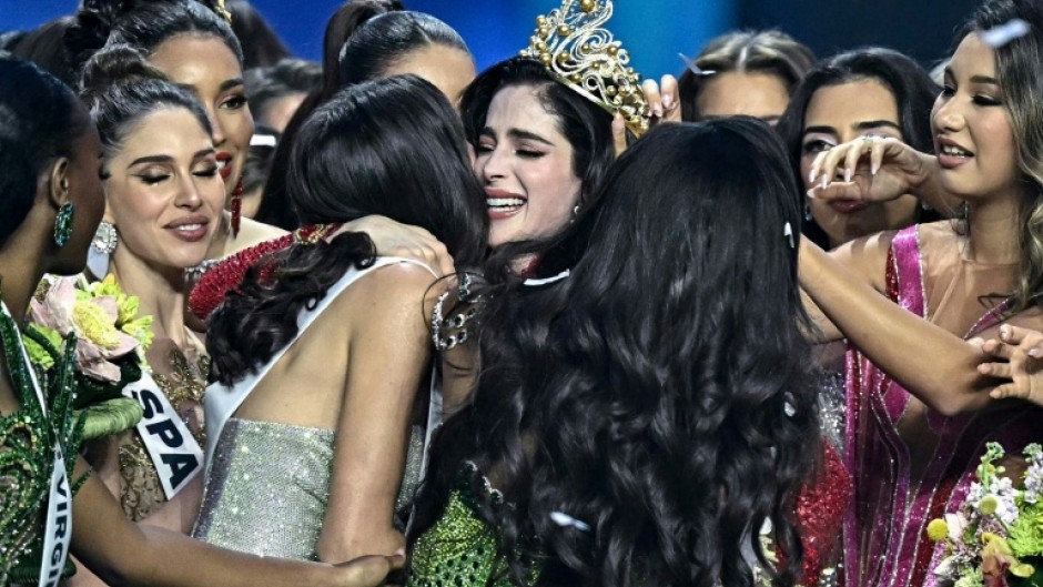 Miss Mexico Fatima Bosch (C) is surrounded by contestants as she celebrates winning the 2025 Miss Universe pageant