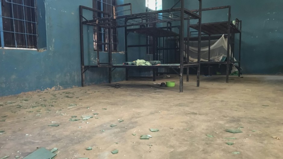 Empty bunk beds, shattered glass and scattered belongings are all that remain in this student dormitory at the school