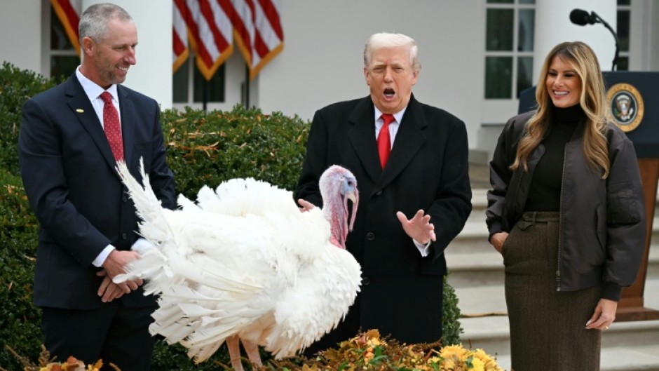 First Lady Melania Trump looks on as US President Donald Trump pardons Gobble, one of the National Thanksgiving turkeys, during a ceremony in the Rose Garden