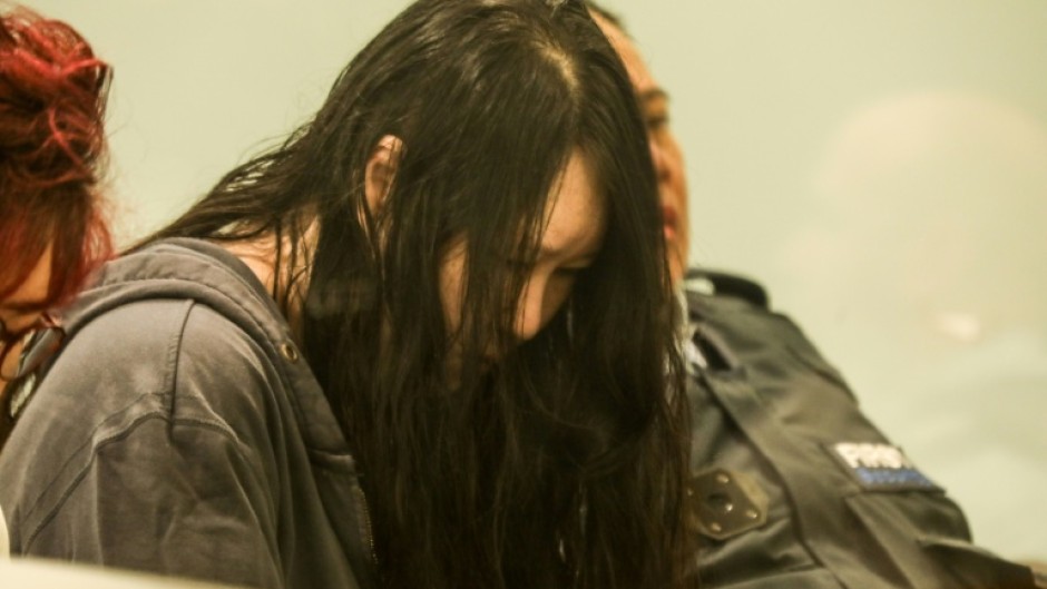 Flanked by security guards and a translator, 45-year-old Hakyung Lee showed little reaction as the sentence was handed down