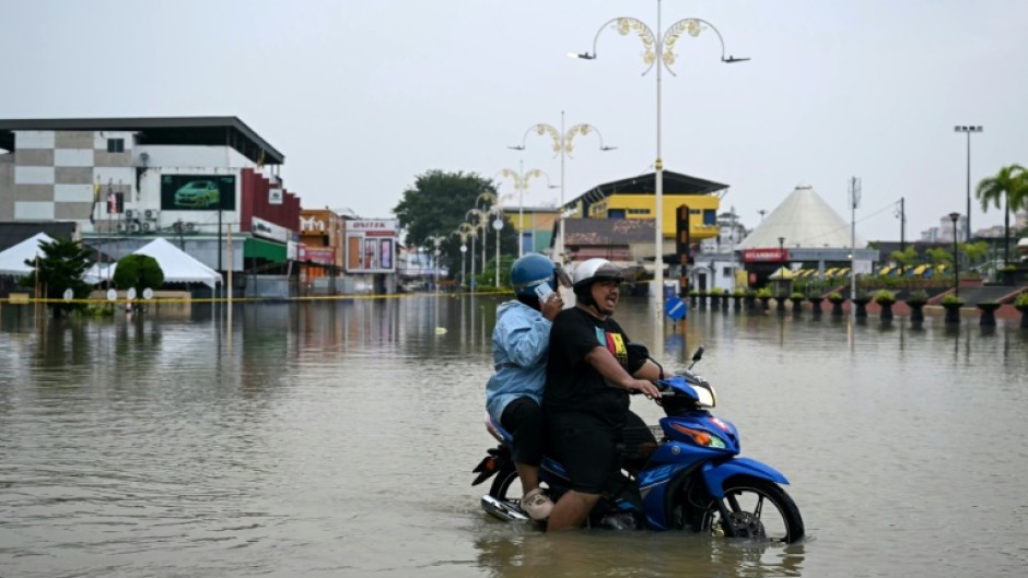 Floods have hit eight states in Malaysia, with more rain forecast