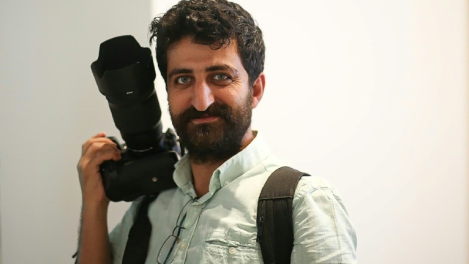 Agence France-Presse's Turkish photographer Yasin Akgul was arrested at his home at dawn on March 24