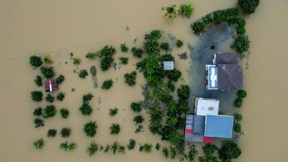 Authorities in three countries are rescuing residents trapped by floodwaters