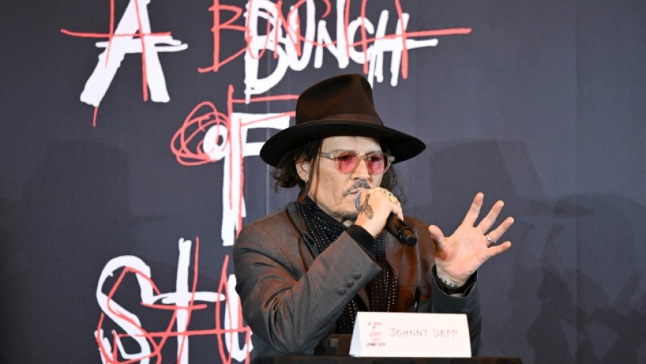US actor Johnny Depp opened an exhibition of dozens of his artworks in Tokyo