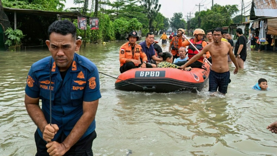 Authorities in Indonesia are trying to reach residents cut off by flooding and landslides