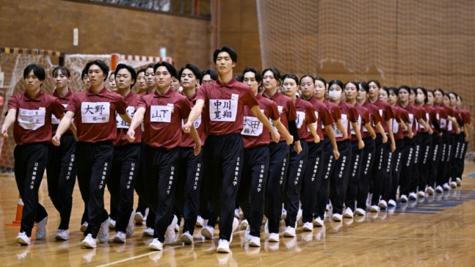 Students at a Japan university rehearse for their annual synchronised walking performance
