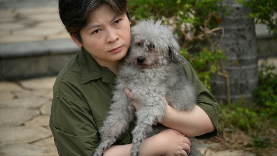 Fifteen-year-old poodle Jason was rescued by firefighters from the Wang Fuk Court blaze and reunited with owner Jacky Lee