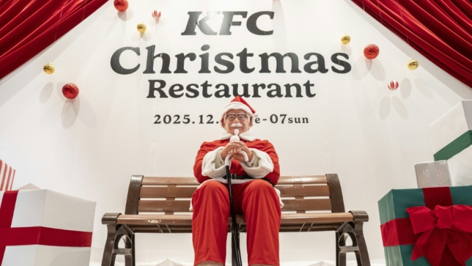 A statue of Colonel Sanders dressed as Santa Claus is displayed at the KFC Christmas restaurant in Tokyo