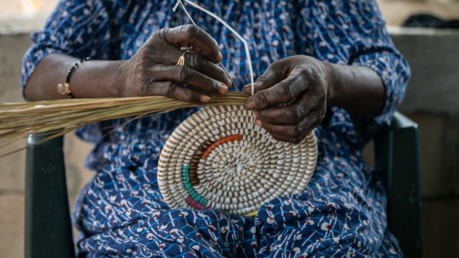 Senegalese-style baskets consist of coiled reeds wound together with colourful plastic strips, which in the olden days would have been palm fibres