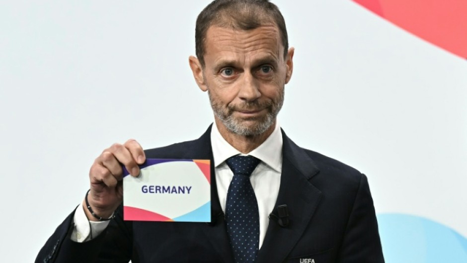 UEFA president Aleksander Ceferin shows the name of Germany, selected as women's 2029 Euros hosts