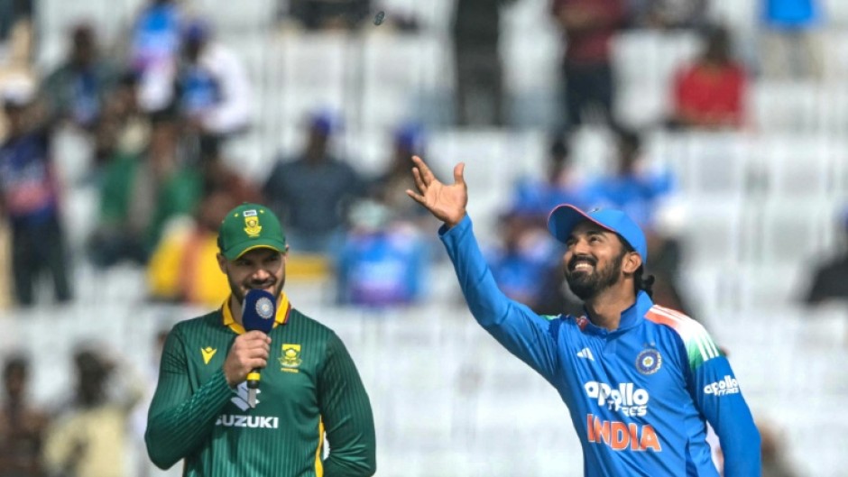 India's captain KL Rahul (R) tosses the coin as his South African counterpart Aiden Markram watches before the start of the first one-day international Ranchi. India have defied million-to-one odds to lose 20 tosses in a row
