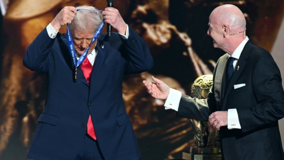 US President Donald Trump receives the FIFA Peace Prize from FIFA chief Gianni Infantino