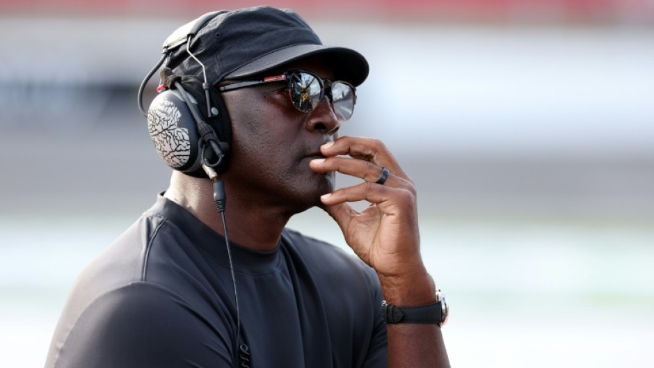 Michael Jordan, NBA Hall of Famer and co-owner of 23XI Racing listens to a race on pit road in October 2025